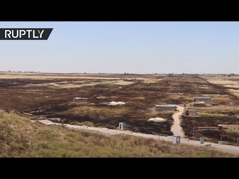 شاهد الحرائق تلتهم المئات من حقول القمح في سورية ومقتل شخصين